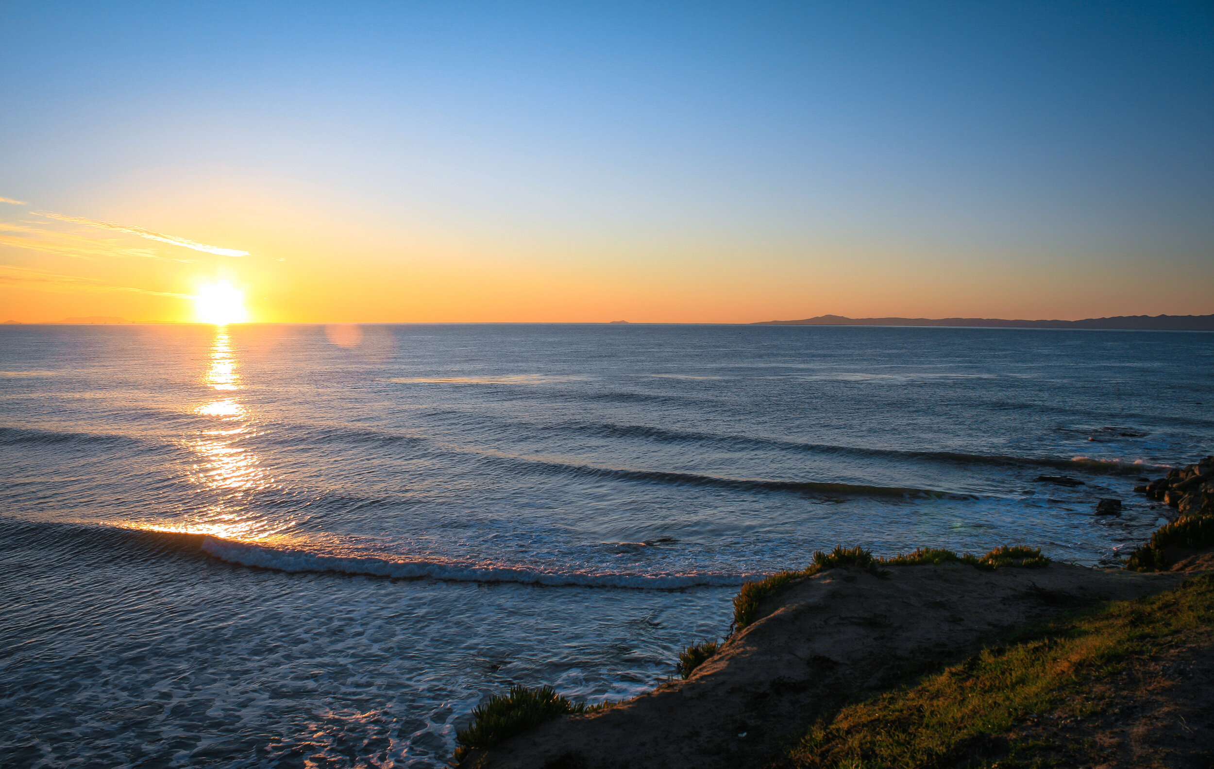 Photo of a sunrise over the ocean.
